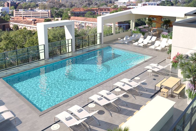Exterior rendering of the pool deck at Ufora, a new student housing apartment in Gainesville near UF in fall 2023